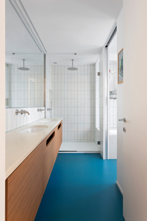 Coastal Allure: Blue Floors and a Vanity with Beige Countertops Enhance Your Bathroom