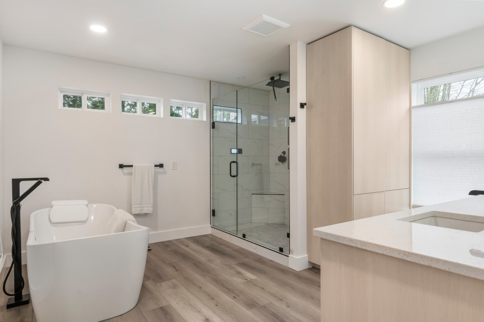 Bathroom - mid-sized modern master white tile and ceramic tile vinyl floor, brown floor and double-sink bathroom idea in Seattle with flat-panel cabinets, beige cabinets, a one-piece toilet, white walls, a drop-in sink, marble countertops, a hinged shower door, white countertops and a built-in vanity