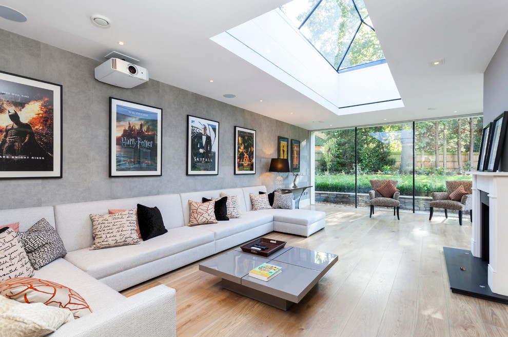 Transitional living room in London with grey walls.