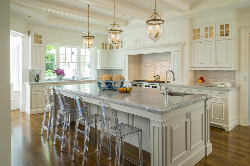 Inspiration for a large traditional eat-in kitchen in Boston with beige splashback, stainless steel appliances, medium hardwood floors and with island.