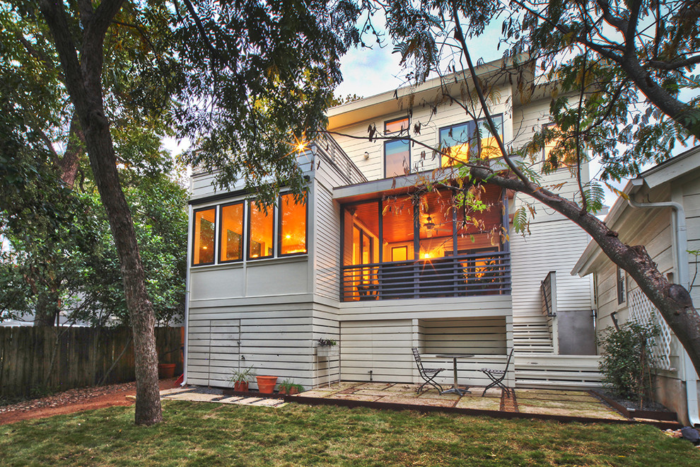 Design ideas for a transitional exterior in Austin with wood siding.