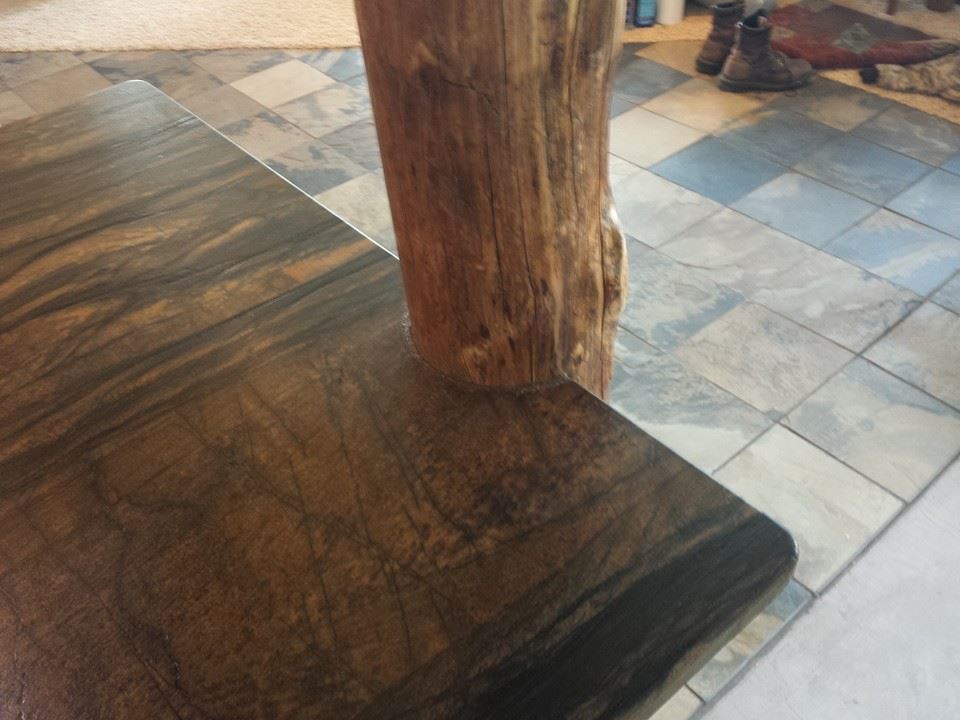 Inspiration for a mid-sized rustic l-shaped slate floor home design remodel with an undermount sink, raised-panel cabinets, light wood cabinets, quartzite countertops, white appliances and an island