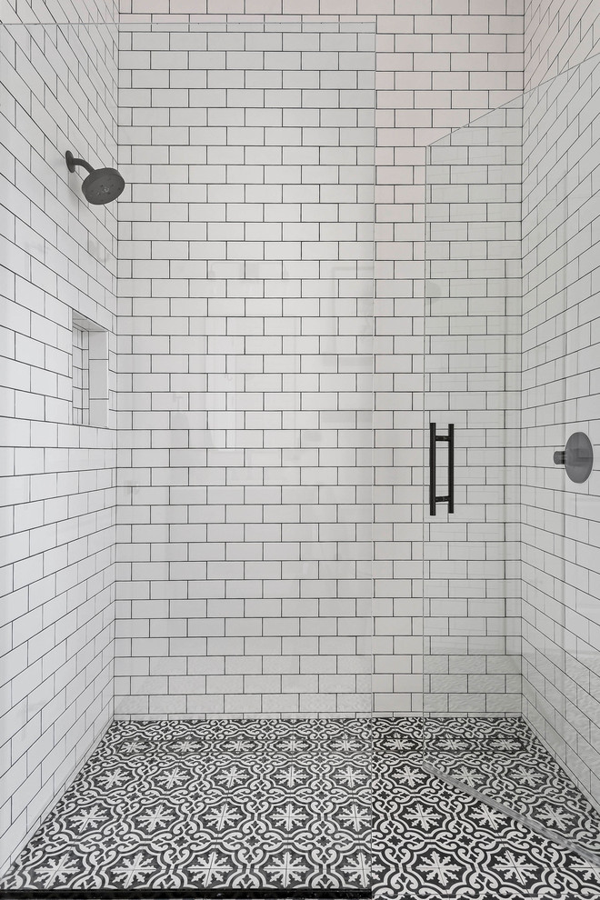 Inspiration for a large transitional 3/4 bathroom in Orlando with dark wood cabinets, a curbless shower, white tile, subway tile, multi-coloured floor, a hinged shower door and cement tiles.