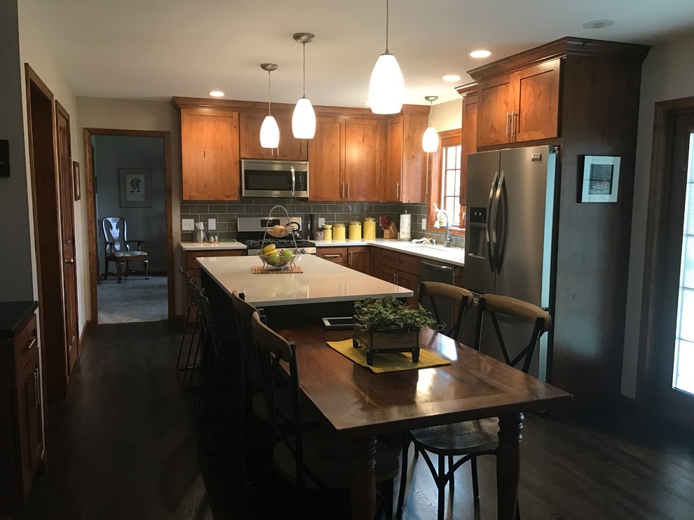 Kitchen - transitional kitchen idea with gray backsplash and an island