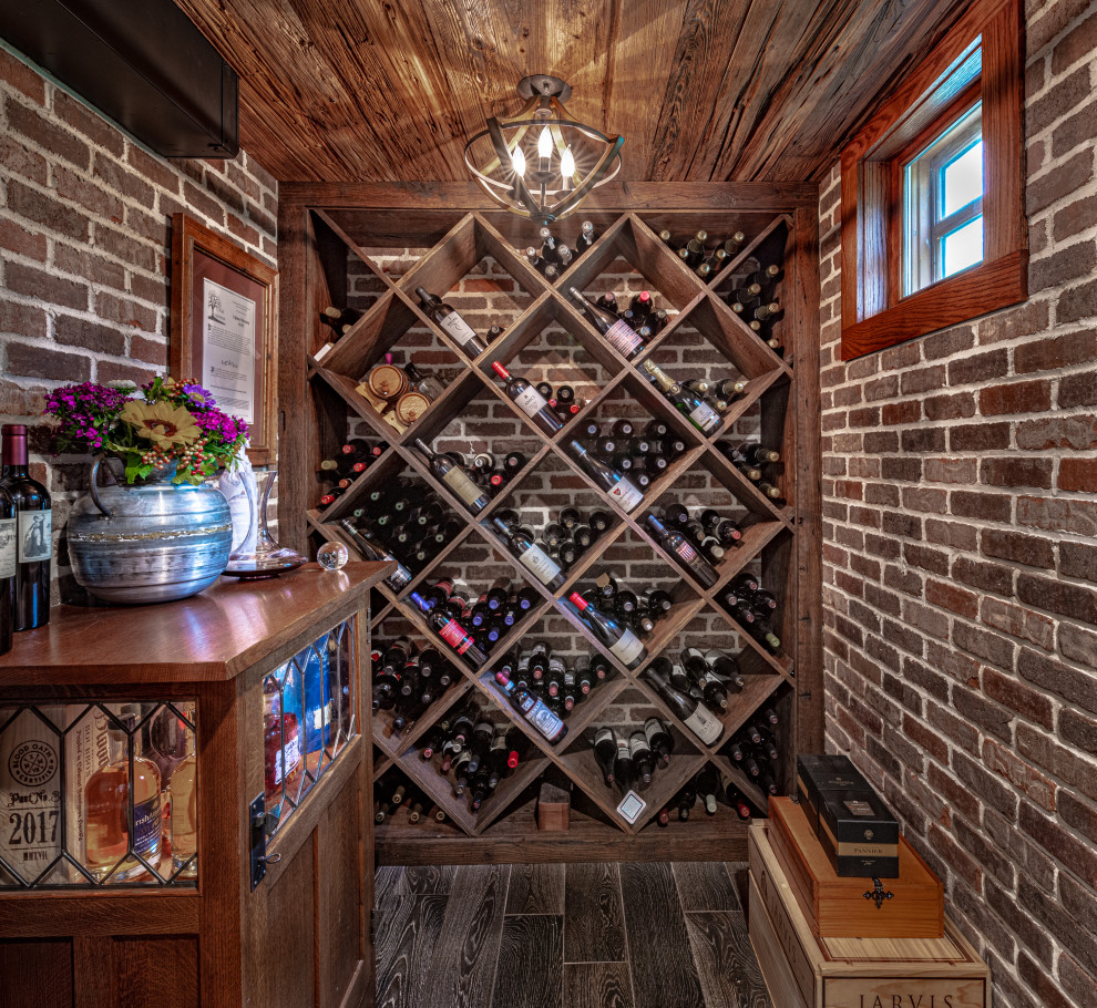 Photo of a small country wine cellar in Philadelphia with porcelain floors and diamond bins.