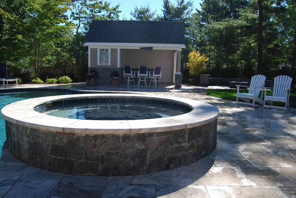 Mid-sized mountain style backyard stone and kidney-shaped natural water slide photo in Boston