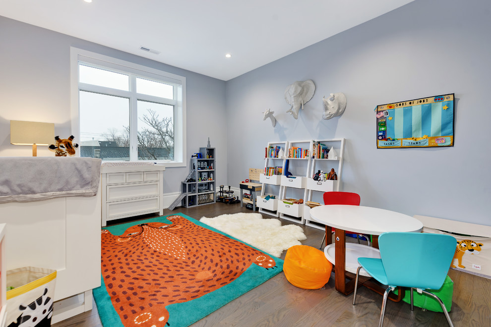 Contemporary gender-neutral kids' bedroom in Chicago with blue walls, medium hardwood floors and brown floor.
