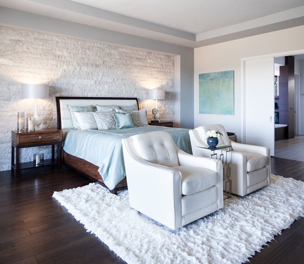 This is an example of a large transitional master bedroom in Sacramento with grey walls, dark hardwood floors and brown floor.