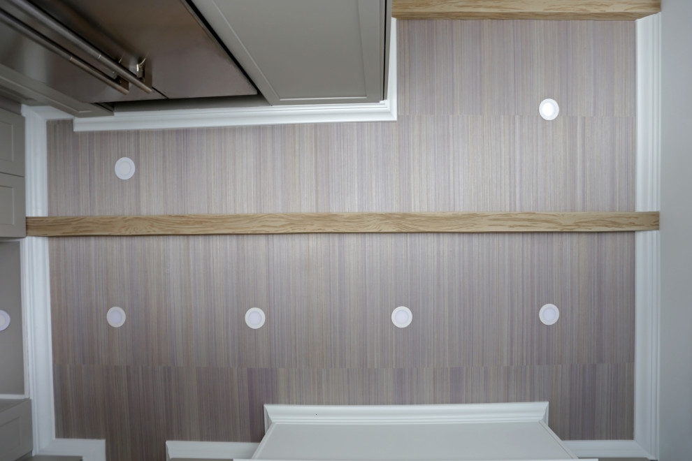 Example of a mid-sized transitional l-shaped marble floor, white floor and exposed beam kitchen design in DC Metro with an undermount sink, shaker cabinets, white cabinets, quartzite countertops, white backsplash, quartz backsplash and stainless steel appliances