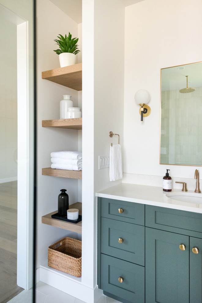 Inspiration for a large traditional ensuite bathroom in Denver with shaker cabinets, green cabinets, white tiles, ceramic tiles, white walls, porcelain flooring, a submerged sink, engineered stone worktops, white floors, an open shower, white worktops, an enclosed toilet, double sinks and a built in vanity unit.