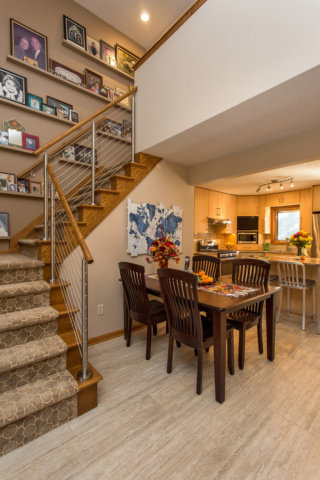 Open concept kitchen - mid-sized transitional l-shaped open concept kitchen idea with an undermount sink, flat-panel cabinets, light wood cabinets, stainless steel appliances, an island and beige backsplash