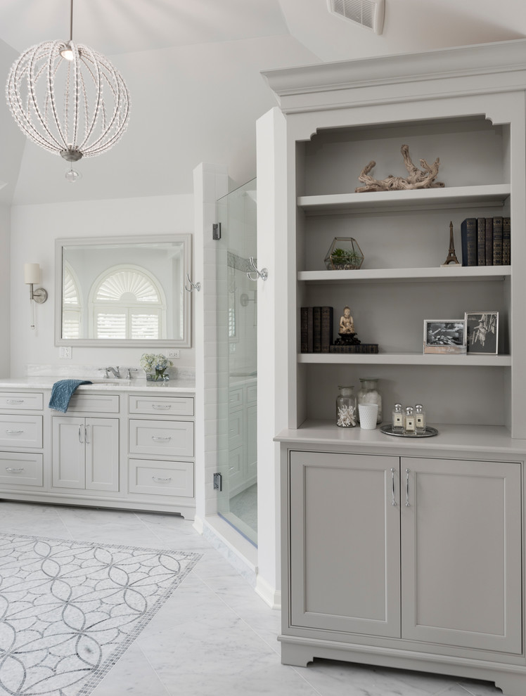Design ideas for a large traditional master bathroom in Chicago with beaded inset cabinets, grey cabinets, a freestanding tub, a corner shower, a two-piece toilet, gray tile, porcelain tile, grey walls, marble floors, an undermount sink, quartzite benchtops, grey floor and a hinged shower door.