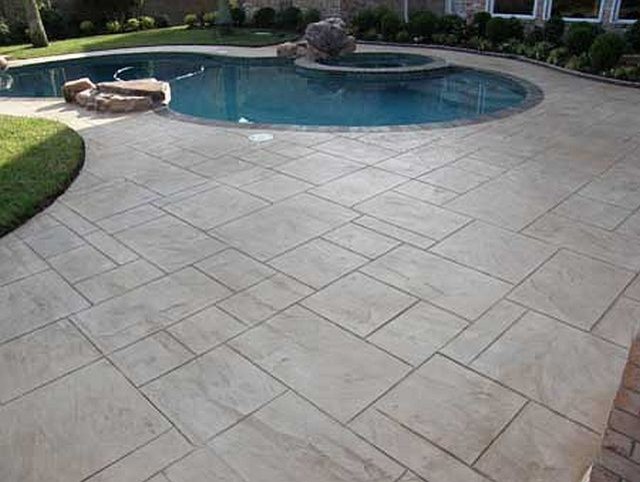 Photo of a pool in Charlotte with stamped concrete.