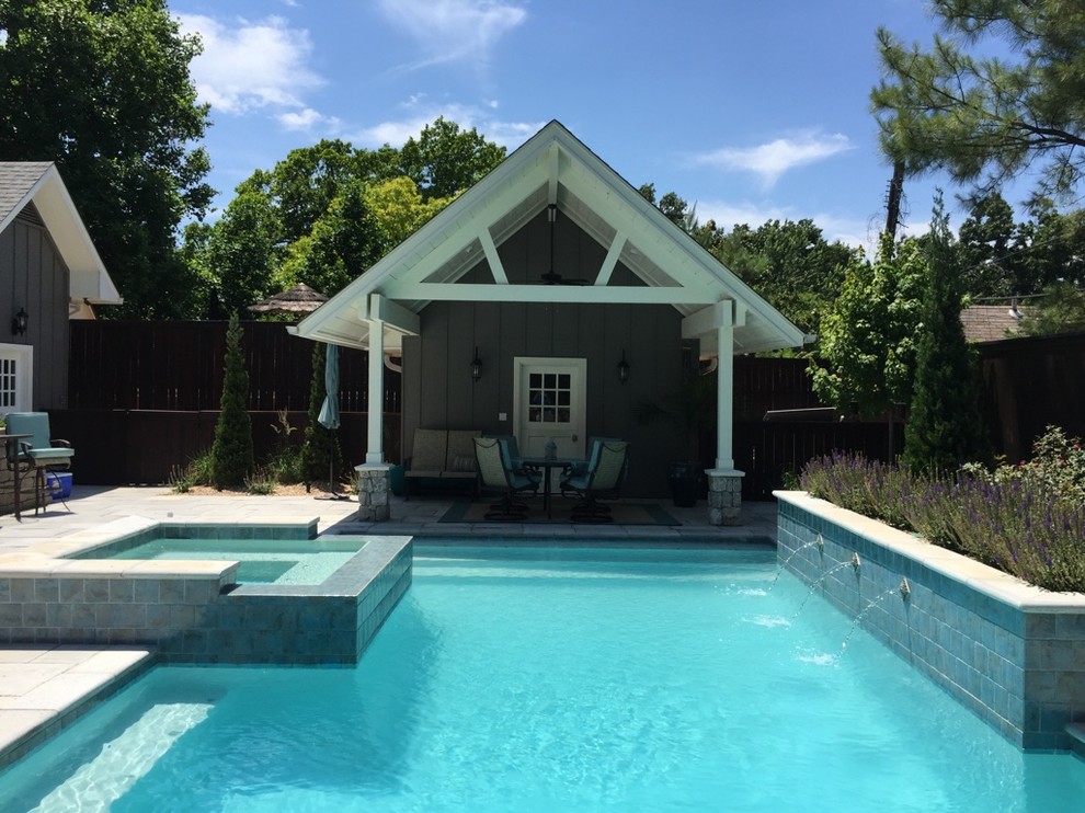 Example of a large transitional backyard concrete paver and rectangular hot tub design