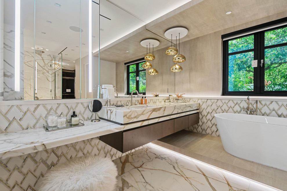 Photo of a contemporary master bathroom in Miami with flat-panel cabinets, medium wood cabinets, a freestanding tub, an alcove shower, an undermount sink, a hinged shower door, multi-coloured benchtops, a single vanity, a floating vanity and wood walls.