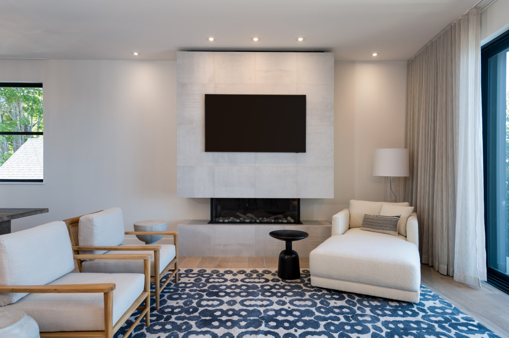 Inspiration for a large contemporary l-shaped light wood floor and brown floor open concept kitchen remodel in Phoenix with an undermount sink, flat-panel cabinets, light wood cabinets, quartz countertops, white backsplash, stone slab backsplash, paneled appliances, an island and white countertops