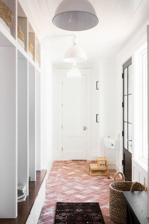 Photo of a mid-sized beach style mudroom in Salt Lake City with brick floors and red floor.