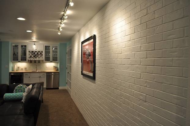 Mid-sized transitional underground carpeted basement photo in Denver with blue walls