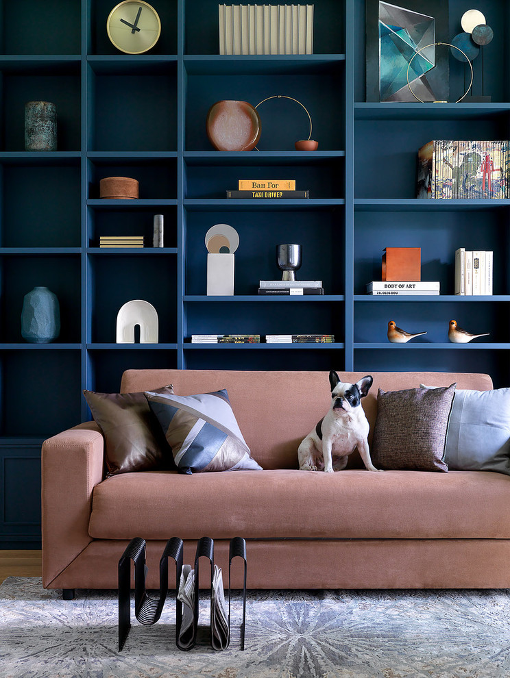 Design ideas for a contemporary living room in Moscow with a library and blue walls.