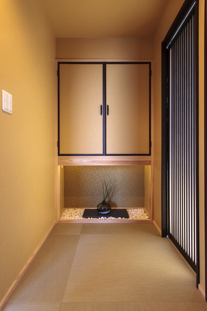 Inspiration for a mid-sized asian hallway in Other with yellow walls, wallpaper and wallpaper.