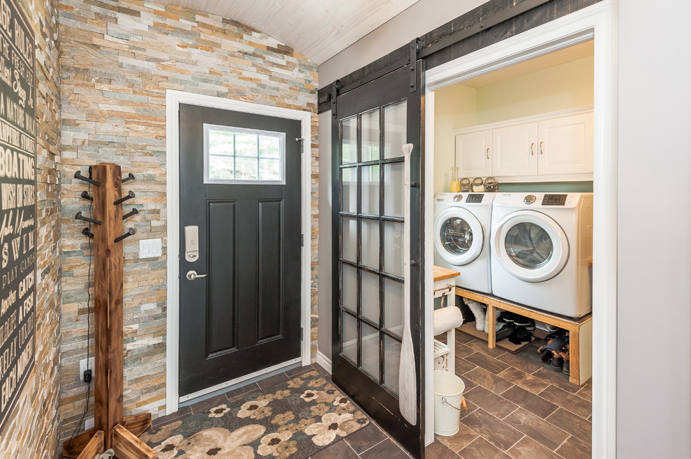 Mid-sized transitional front door photo with gray walls and a black front door