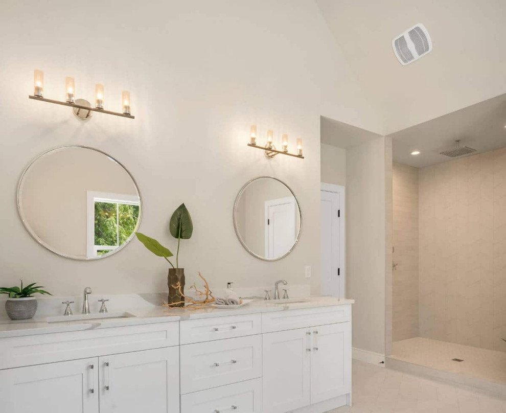 This is an example of a mid-sized beach style master bathroom in Seattle with shaker cabinets, light wood cabinets, beige tile, beige walls, an undermount sink, quartzite benchtops, white benchtops, a double vanity, a freestanding vanity, coffered and porcelain tile.