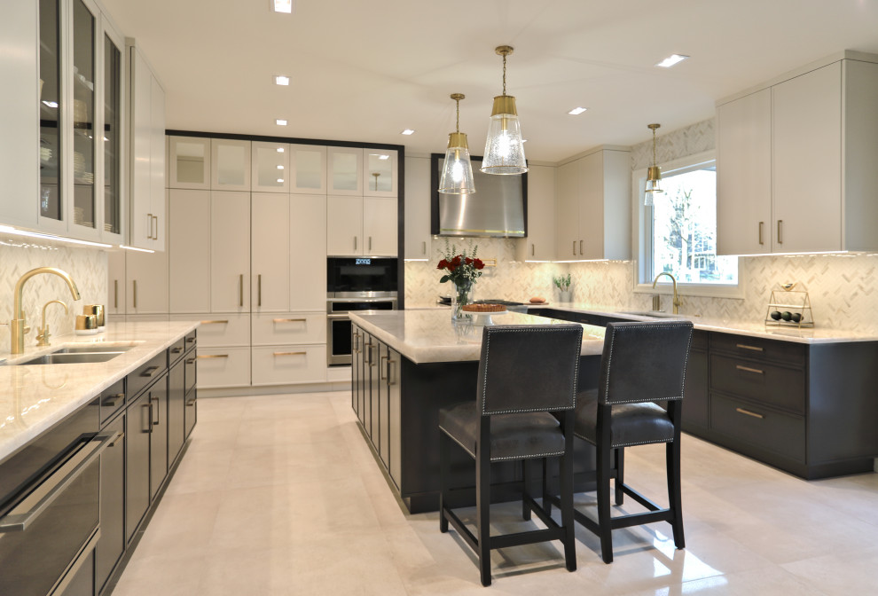 Large contemporary u-shaped kitchen/diner in New York with a submerged sink, recessed-panel cabinets, white cabinets, quartz worktops, white splashback, mosaic tiled splashback, stainless steel appliances, porcelain flooring, an island, beige floors and white worktops.