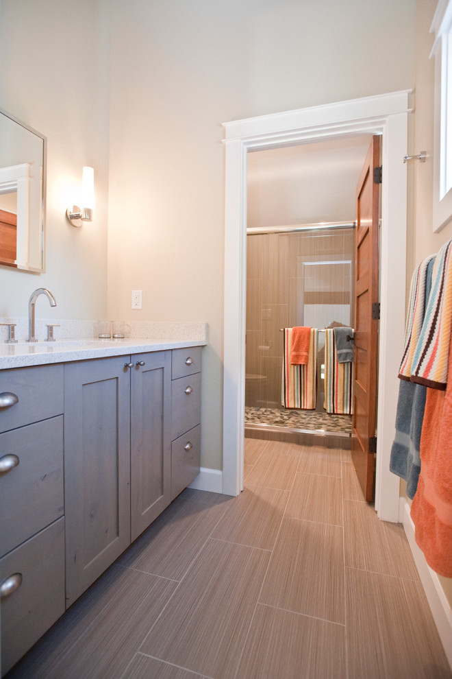 Example of a mid-sized transitional kids' gray tile and ceramic tile ceramic tile bathroom design with an undermount sink, shaker cabinets, gray cabinets, quartz countertops and gray walls