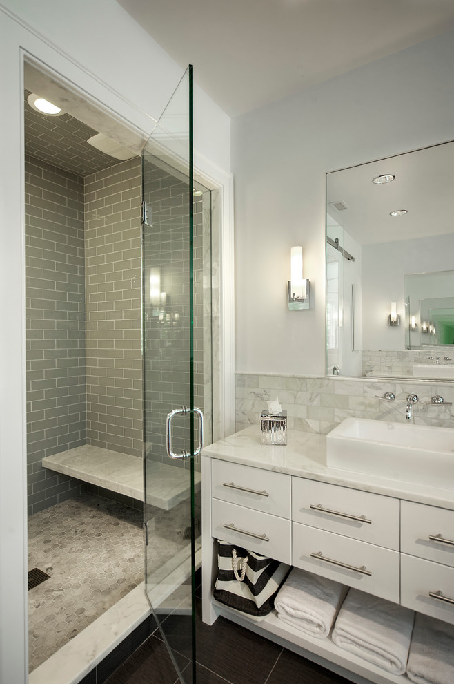 Design ideas for a contemporary bathroom in Columbus with subway tile and a vessel sink.