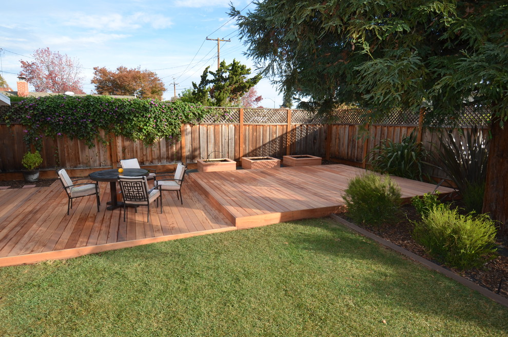 This is an example of a large contemporary backyard deck in San Francisco with no cover.