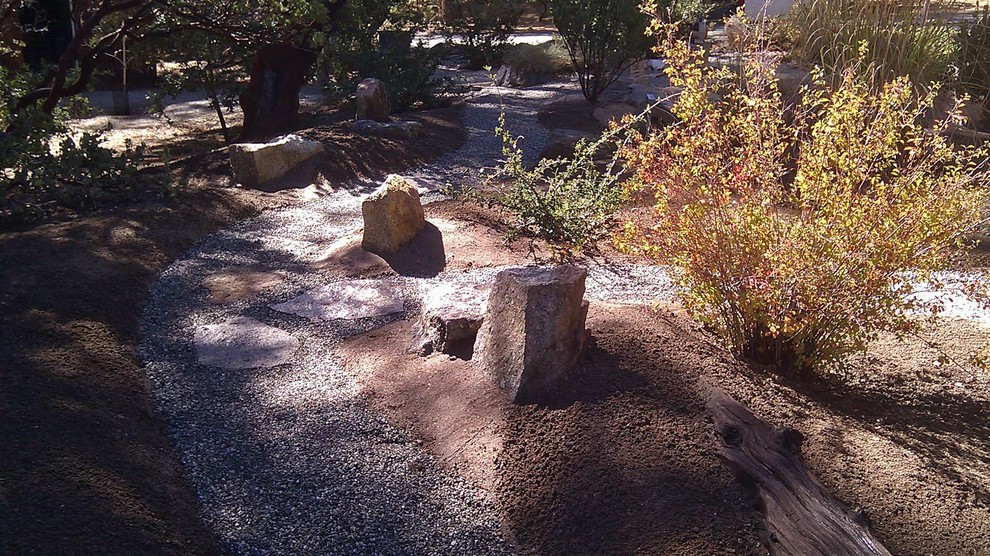 Photo of a rustic backyard gravel garden path.