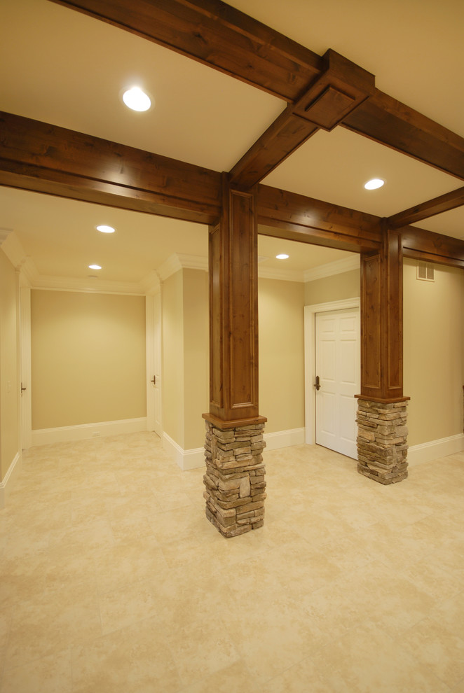 Basement - large rustic carpeted and beige floor basement idea in Birmingham with beige walls, a two-sided fireplace and a stone fireplace