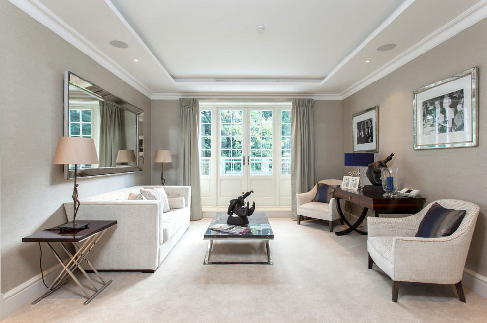Photo of a large transitional living room in London with grey walls.
