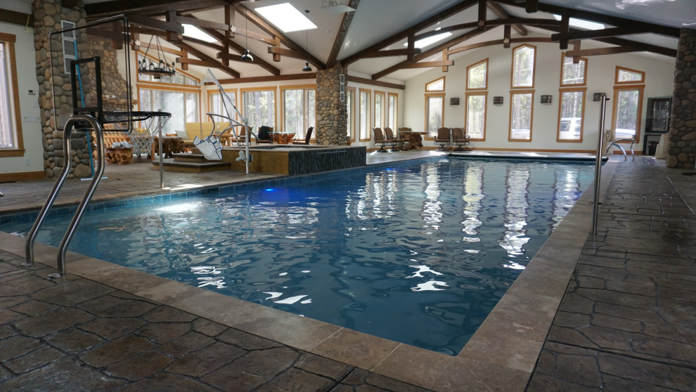 Mountain style pool photo in Calgary