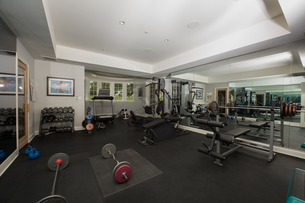 Inspiration for a large traditional multipurpose gym in Chicago with multi-coloured walls, vinyl floors and black floor.