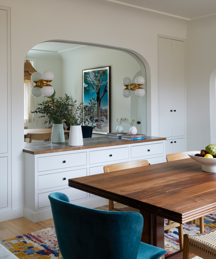 Photo of a traditional separate dining room in Portland with white walls.