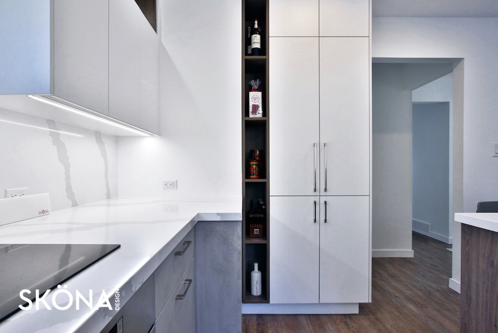 Photo of a mid-sized scandinavian u-shaped eat-in kitchen in Toronto with flat-panel cabinets, grey cabinets, white splashback and with island.