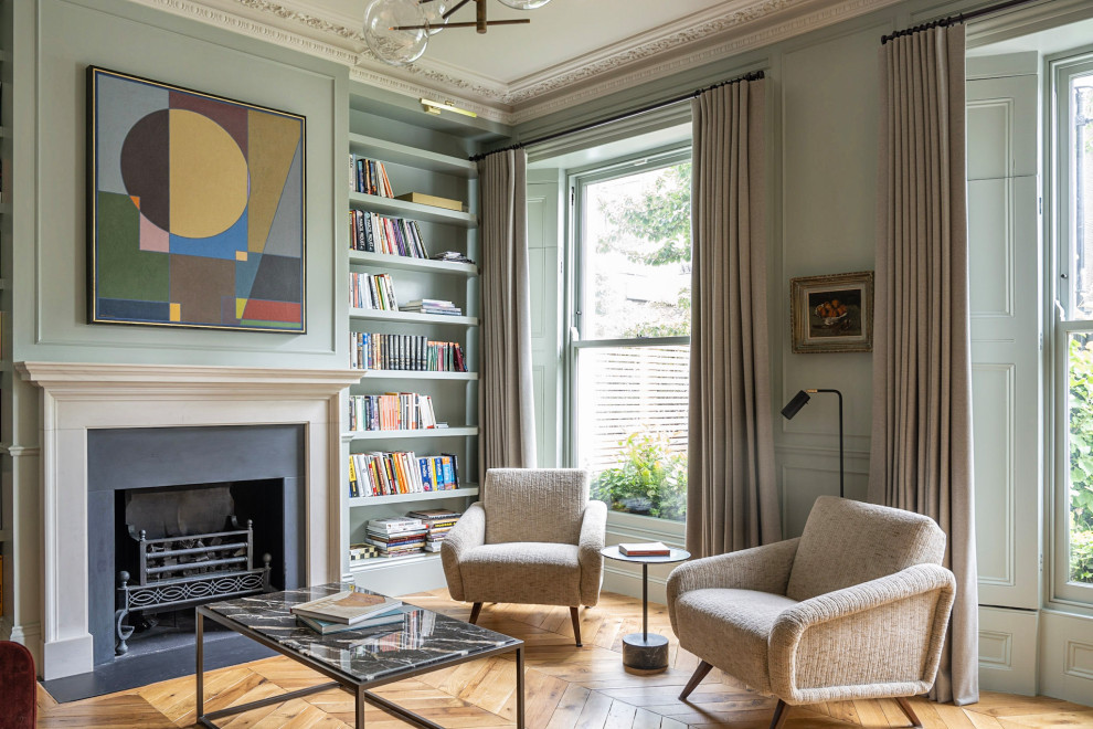 Photo of a transitional living room in London with panelled walls.