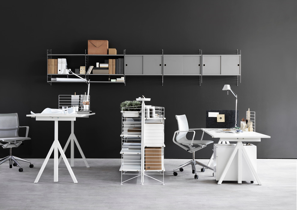 Photo of a contemporary home office in Cologne with grey walls.