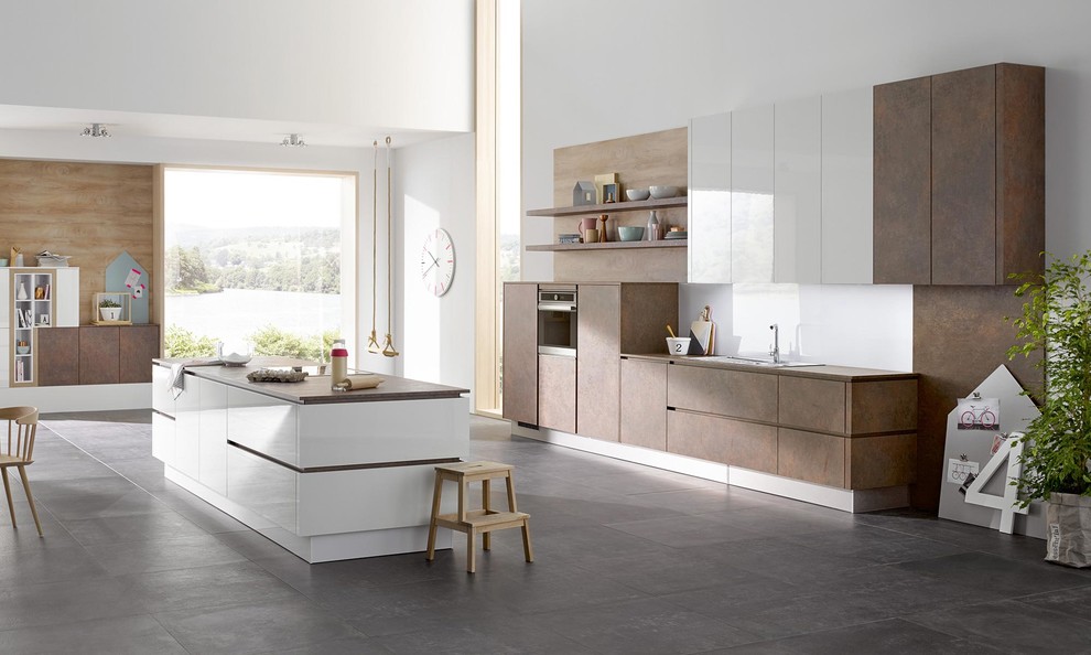 Inspiration for a mid-sized modern single-wall open plan kitchen in New York with flat-panel cabinets, brown cabinets, quartz benchtops, white splashback, glass sheet splashback, cement tiles, with island and grey floor.