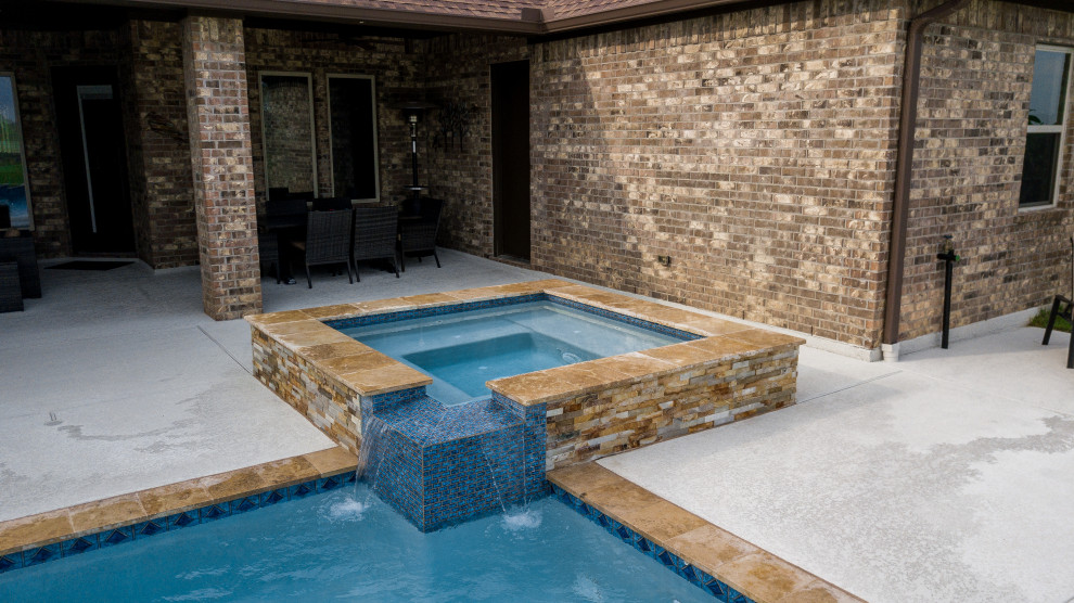 Mid-sized contemporary backyard rectangular pool in Houston with decking.