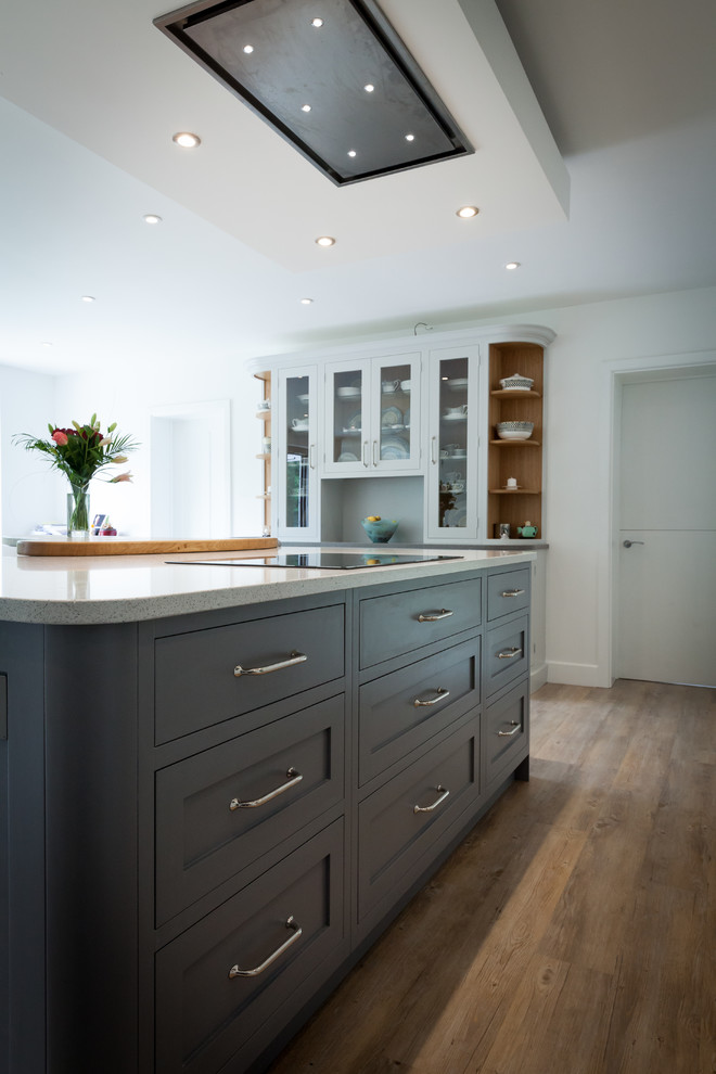 Photo of a mid-sized arts and crafts u-shaped eat-in kitchen in Surrey with an undermount sink, shaker cabinets, grey cabinets, quartz benchtops, stainless steel appliances, vinyl floors, with island, brown floor and multi-coloured benchtop.