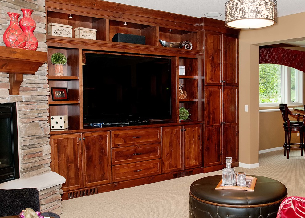 Example of a large transitional underground carpeted basement design with beige walls, a standard fireplace and a stone fireplace