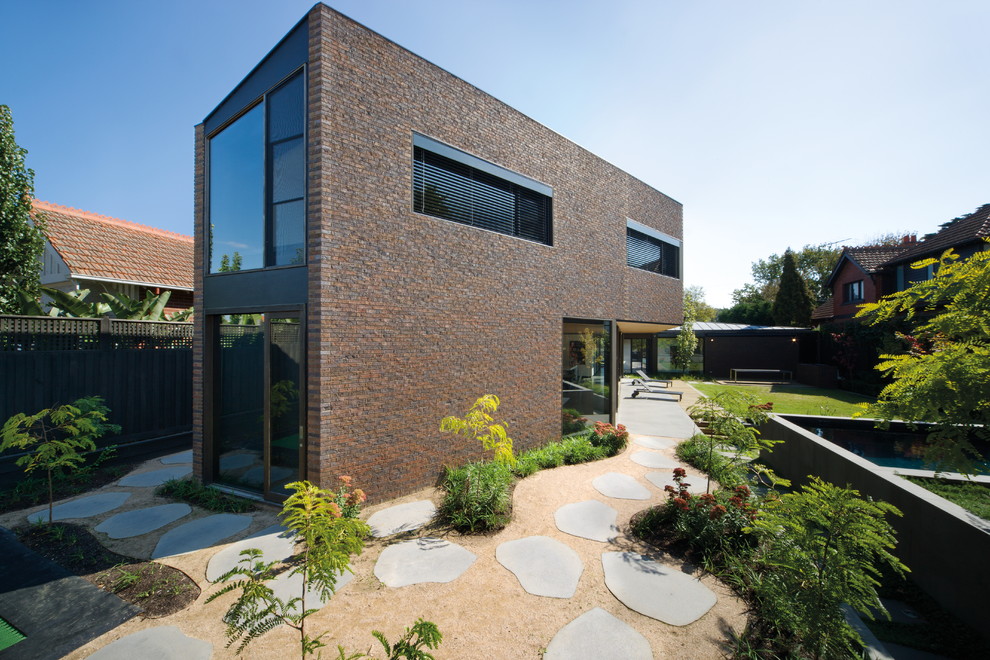 Large contemporary two-storey brick brown exterior in Melbourne.