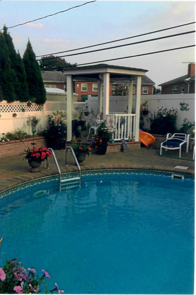 Pool with Whirl pool spill over, outdoor kitchen, outdoor bar, Pergola& Patio