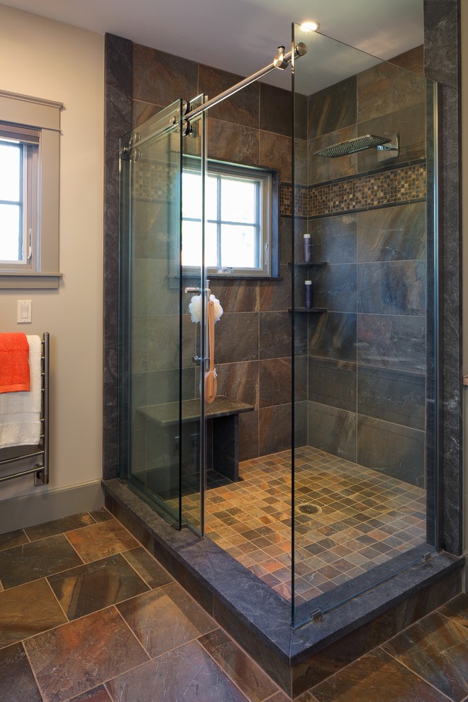 Photo of a mid-sized country master bathroom in Portland Maine with a corner shower, brown tile, gray tile, slate, white walls, slate floors, brown floor and a sliding shower screen.