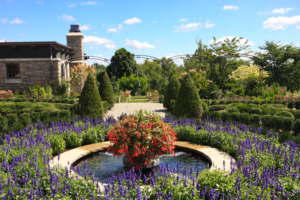 Photo of a traditional full sun backyard water fountain landscape in New York.