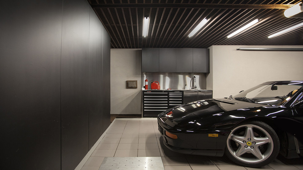 Photo of a contemporary one-car garage in Montreal.