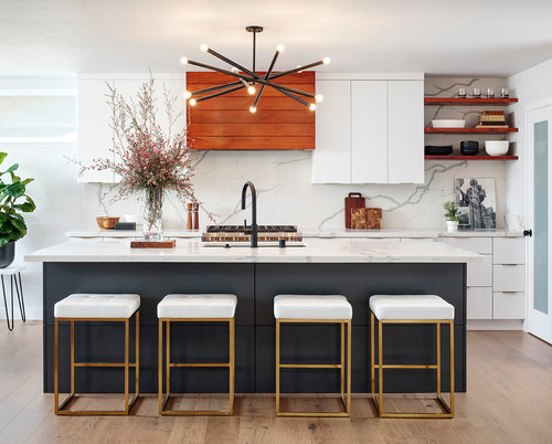 Handleless RTA cabinets with white slab fronts, black island, and marble-look backsplash for easy-clean surfaces