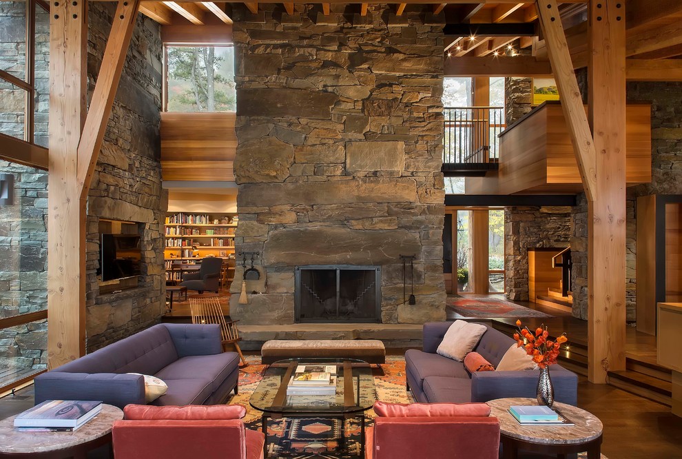 Design ideas for a large modern loft-style living room in New York with a two-sided fireplace, a stone fireplace surround and a built-in media wall.